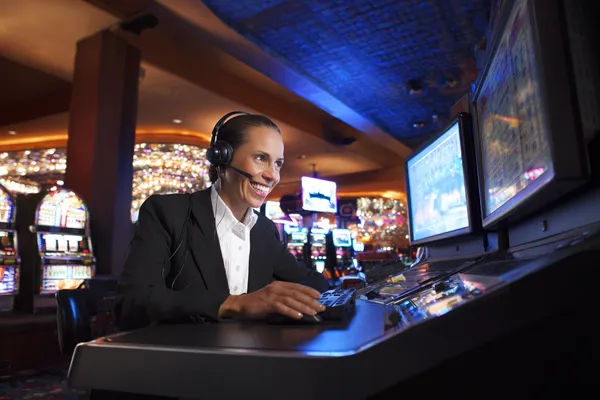 A cheerful woman in traditional clothing using her smartphone during a festive moment, showing how easily the STARMAX88 app fits into everyday life.