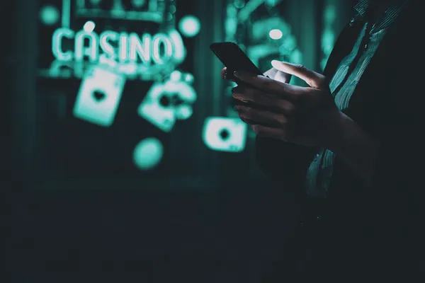 A close-up shot of golden coins falling around a spinning roulette wheel, representing immersive casino action at STARMAX88.