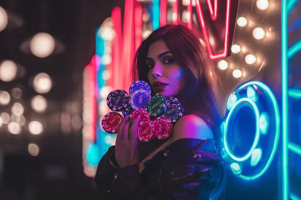 A woman in a luxurious green gown next to an ornate roulette wheel, capturing the upscale casino mood of STARMAX88.
